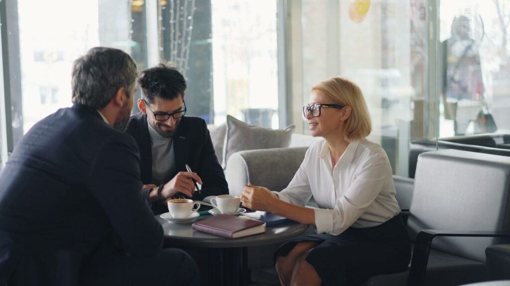 Business colleagues discussing priorities together in a meeting