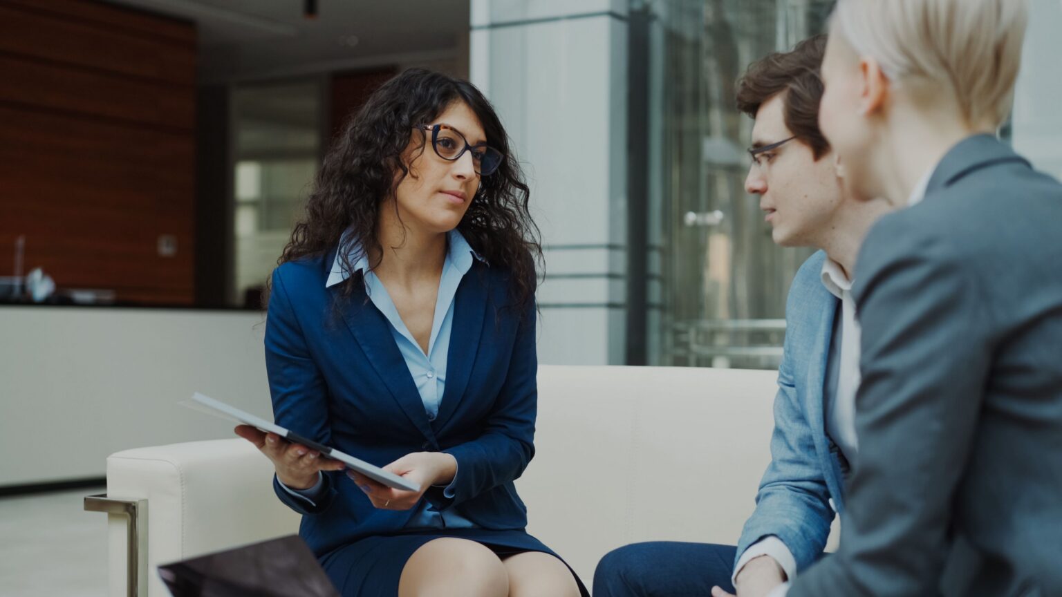 Financial services professional in a modern office lounge